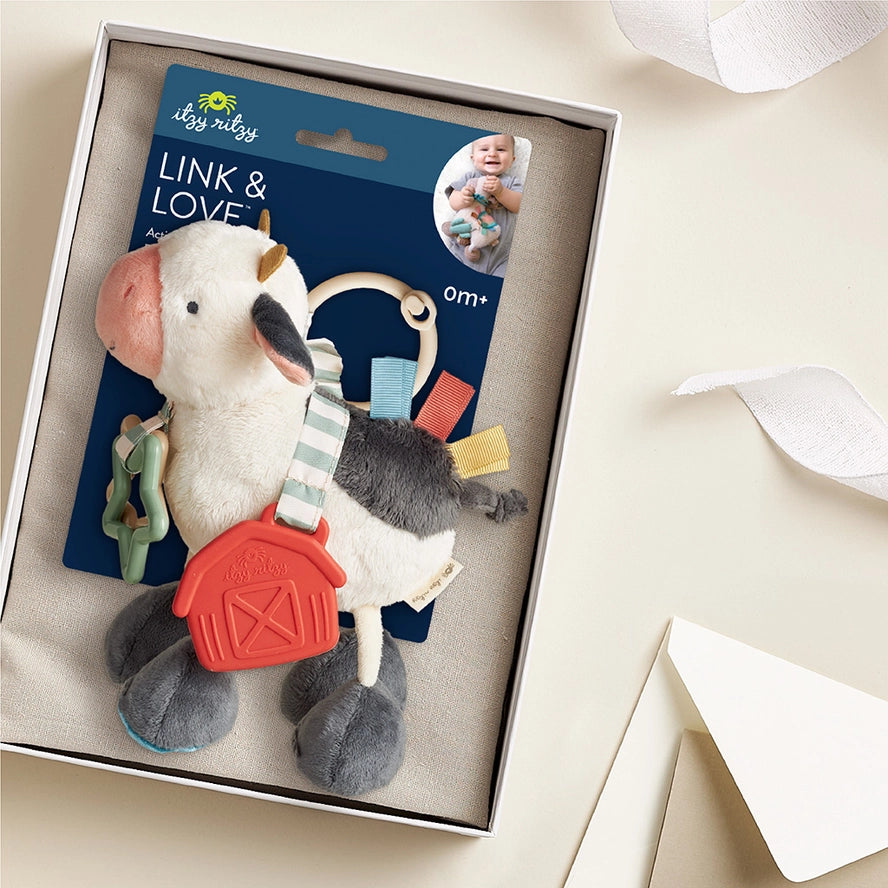 Itzy Ritzy Itzy Friends Link & Love™ Cow Activity Plush with Teether Toy